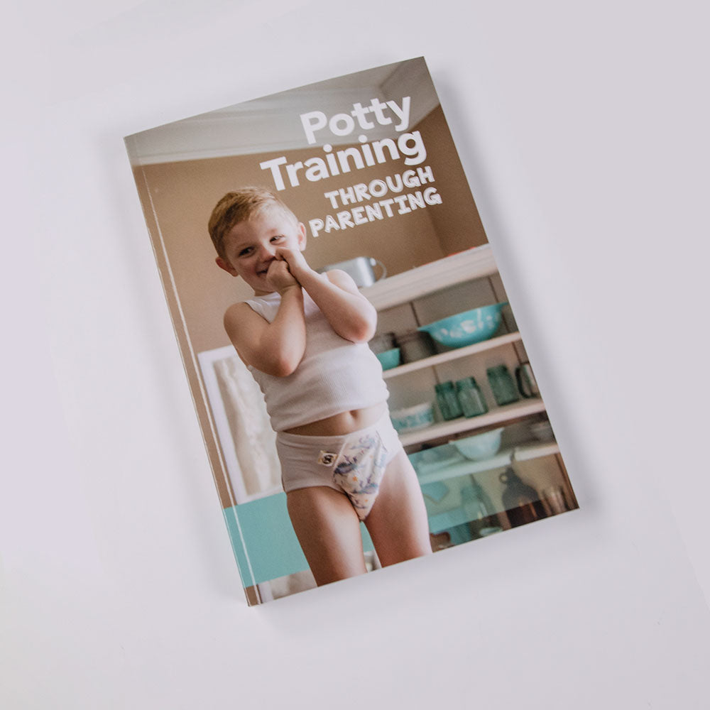 The image shows a book cover with a child in a potty training phase. The title of the book is 'Potty Training Through Parenting' and the subtitle is 'A Practical Guide for Parents'.